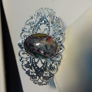 Antique style bracelet with one of a kind center black,pink,red,purple center